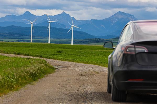 wind turbines and zev car in field