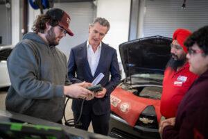 Gavin Newsom with auto mechanic